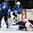 GRAND FORKS, NORTH DAKOTA - APRIL 23: USA's Kaller Yamamoto #23 gets tangled up with Finland's Ukko-Pekka Luukkonen #1 while Robin Salo #4 looks on during semifinal round action at the 2016 IIHF Ice Hockey U18 World Championship. (Photo by Minas Panagiotakis/HHOF-IIHF Images)

